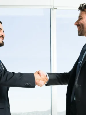 building-collaborative-teamwork-handsome-businessman-business-executive-getting-know-each-other-while-shaking-hands-work-meeting